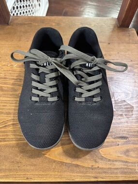 NoBull black shoes with army green laces.